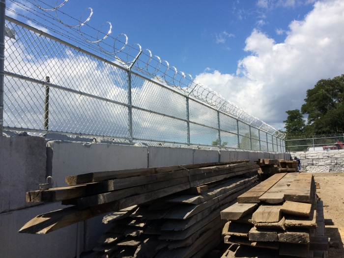 Galvanized Chain Link Fence on a Wall with 6 Strand Barbed Wire and Razor Ribbon