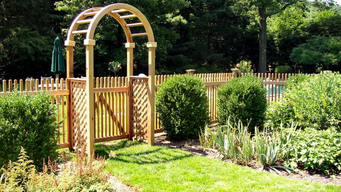 Custom Wood Picket Fencing with Cedar Arbor