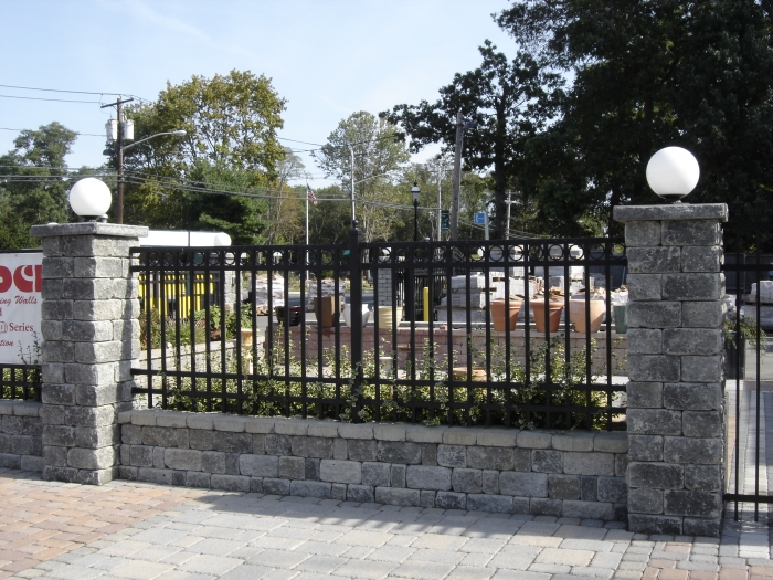 Ornamental Fencing on a Wall Between Piers with Lights